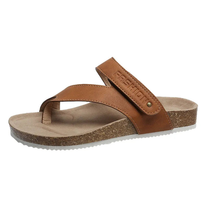 A pair of flat toe ring thick-soled flip-flops in a solid colour on a plain background.