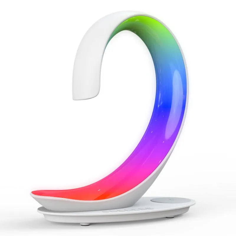 White swan shaped desktop lamp with wireless charging pad, Bluetooth speaker and colourful LED mood lighting