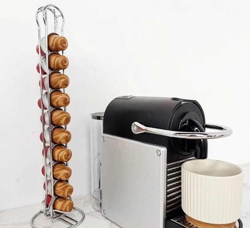 A black wrought iron stand holding 20 coffee capsules on open shelves, measuring 10x10x37cm.