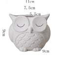 Handmade frosted ceramic flower pot with cartoon owl design, shown in light pink colour.