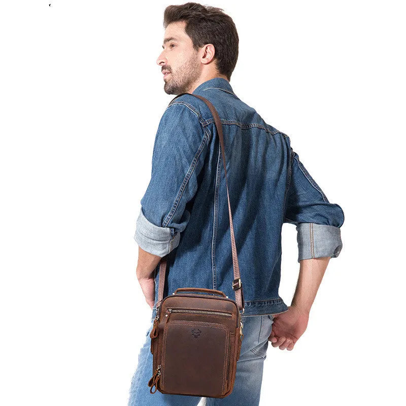 Men's brown genuine leather retro style crossbody bag with sewing line detail.