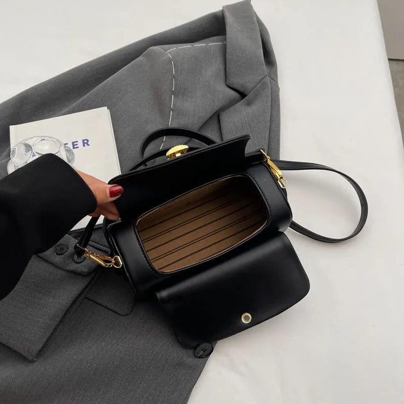 Women's personalised PU leather shoulder messenger bag in beige with letter detailing and stitching.