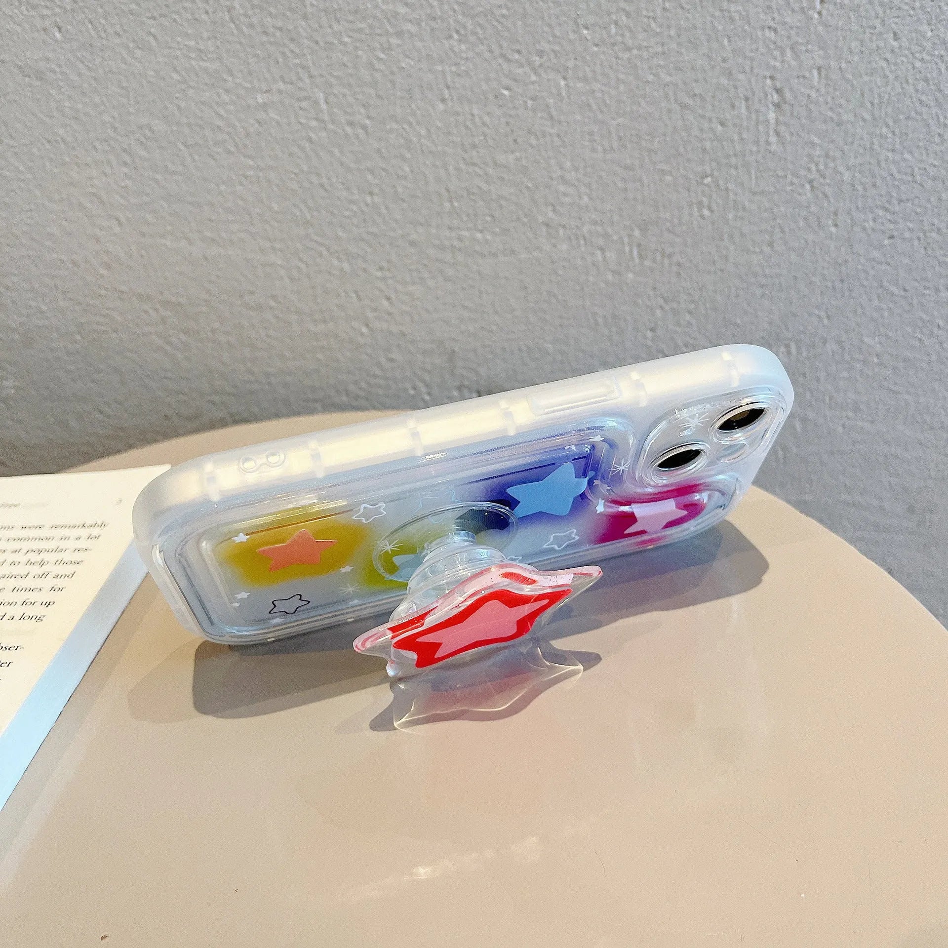 Blooming color TPU phone case with built-in bracket on an iPhone, showing airbag edge design