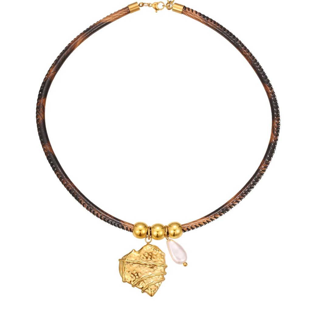 Geometric leopard print pendant on a gold-toned stainless steel necklace for women.