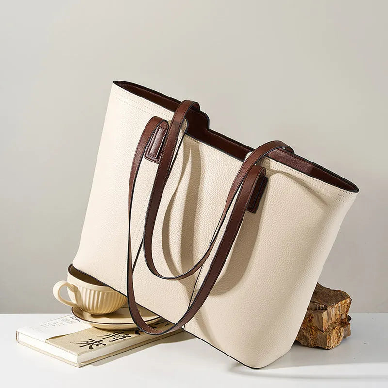 Women's genuine leather crossbody commuter bag in horizontal square shape with multiple internal compartments