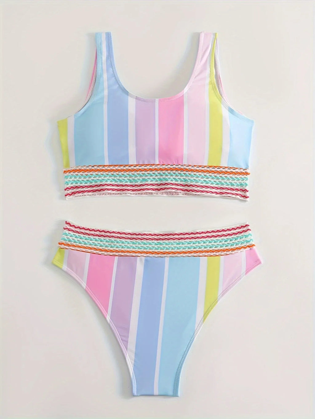 Women's striped two-piece bikini set in a sports casual design on a mannequin.