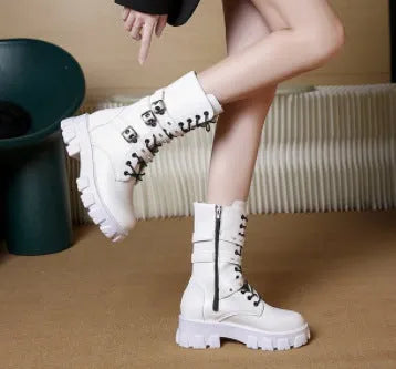 Women's black mid-calf knight boots with a side zip and metal buckle detail on the shaft.