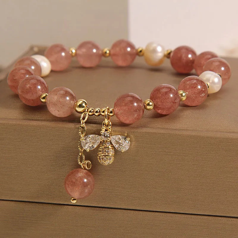 Freshwater pearl and strawberry quartz bracelet with zircon flower charms