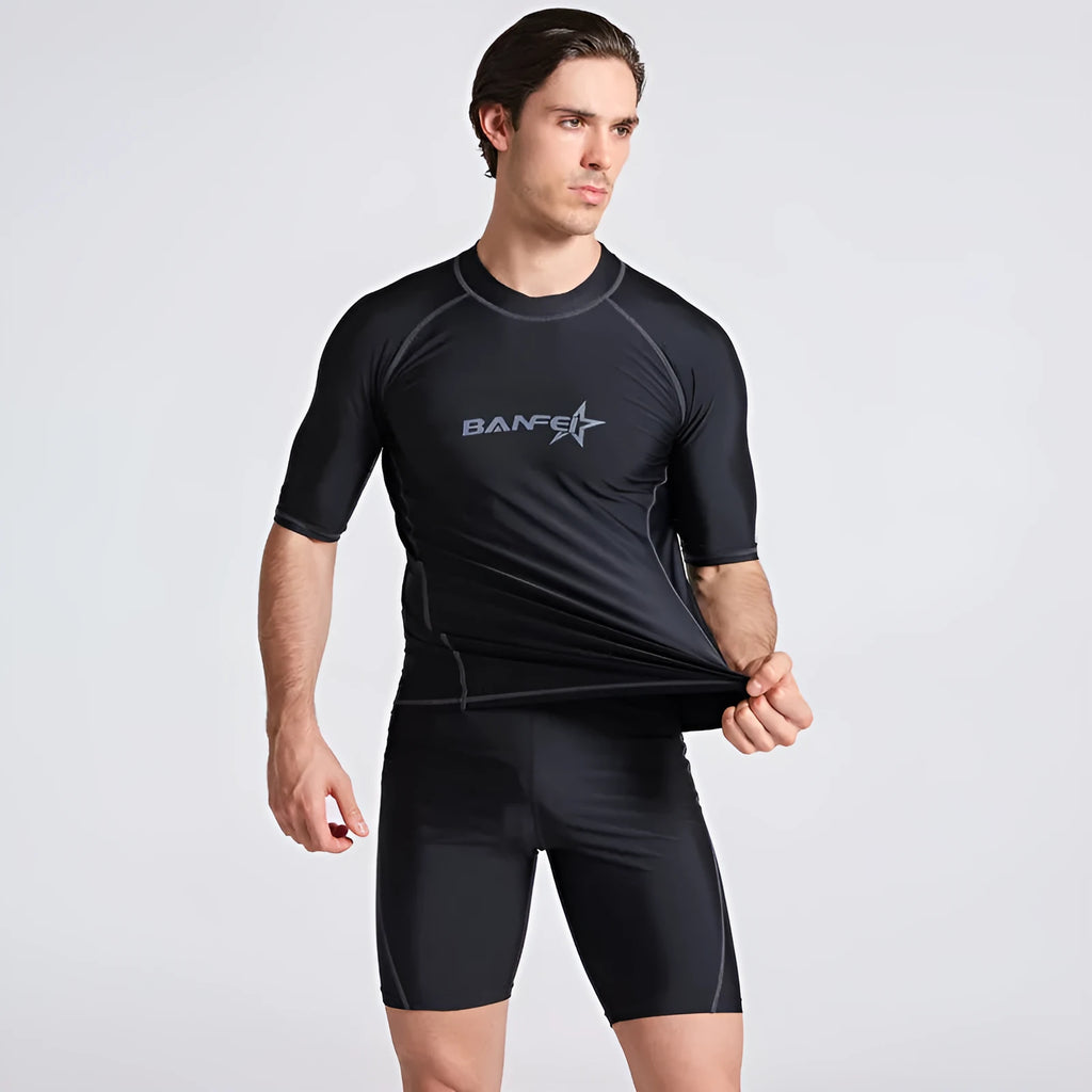 Men's navy blue quick-drying nylon swimsuit set with half-sleeve top and pants for swimming and surfing.
