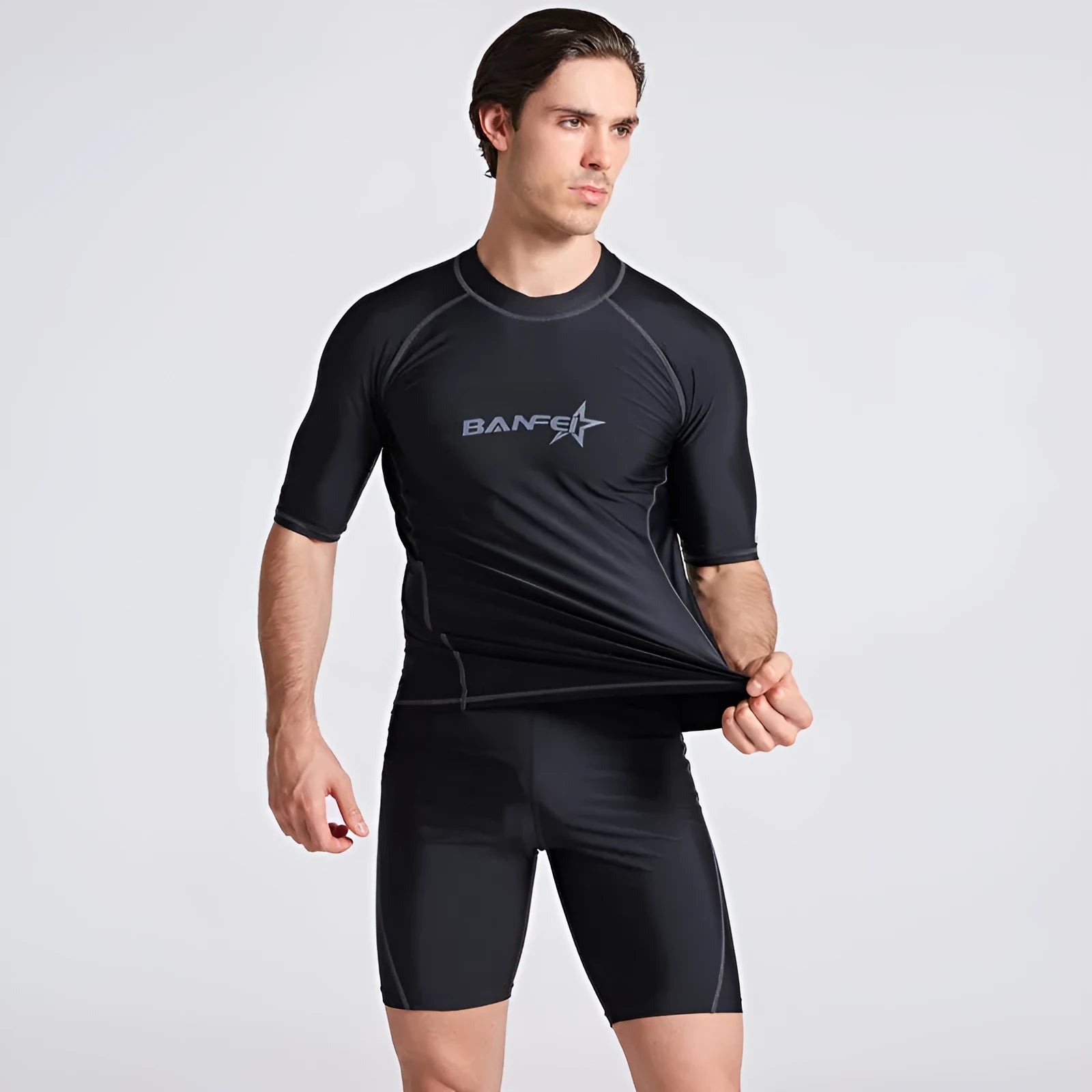 Men's navy blue quick-drying nylon swimsuit set with half-sleeve top and pants for swimming and surfing.