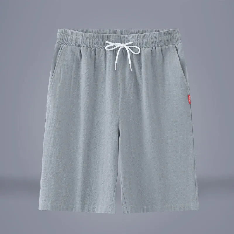 Solid colour cotton linen cropped summer pants with a drawstring waist on a hanger.