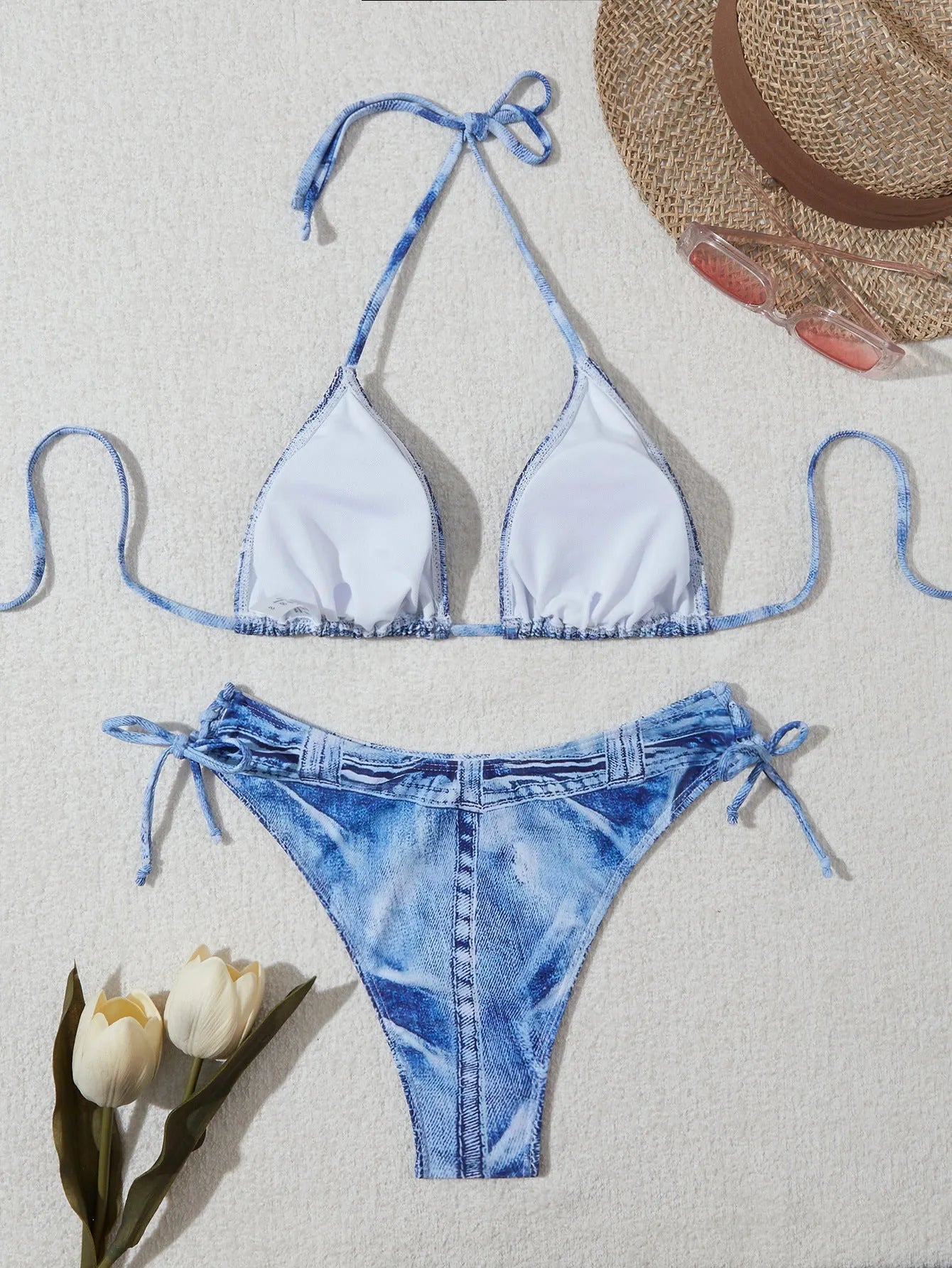 Women's blue denim print strappy bikini set, two-piece swimsuit on a white background.