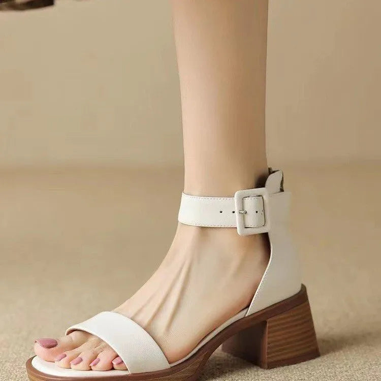 Women's white retro platform high heels with an ankle strap and round toe.