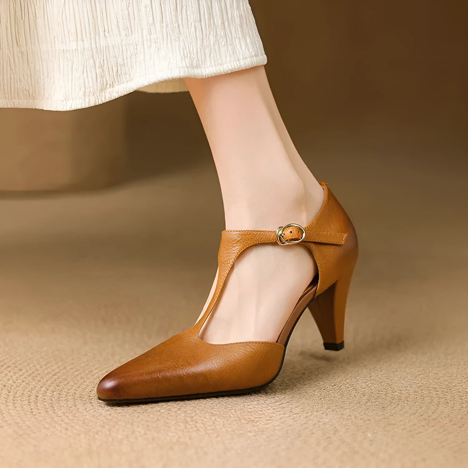 Brown retro women's T-strap sandals with a closed round toe, buckle fastening, and a chunky block heel.