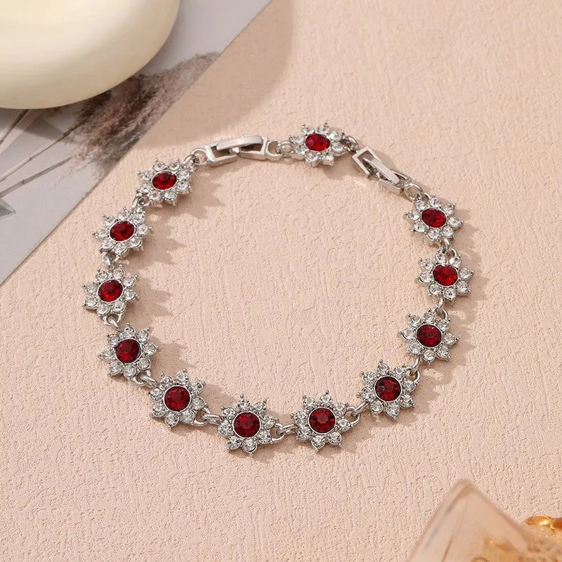 Floral-shaped zinc alloy bracelet with electroplated finish in gold and silver colour options.