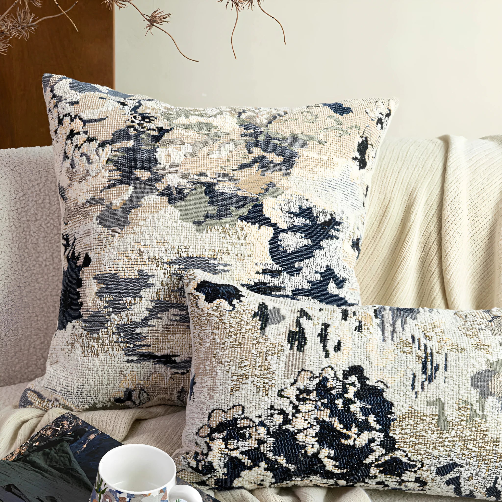 Antique blue decorative cushion with abstract floral artistic pattern on wool blend fabric, shown in square and rectangular sizes.
