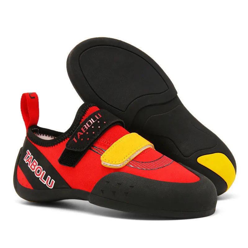 Beginner rock climbing shoes with Velcro strap in black and red colour.