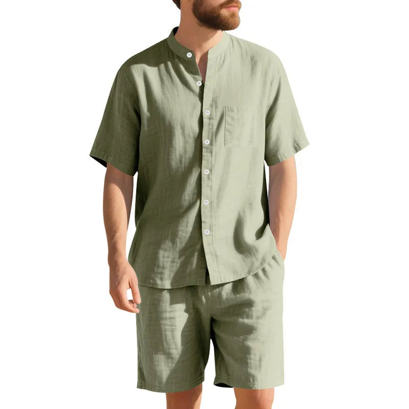 Men's light blue linen blend summer suit with henry collar, short sleeves, and matching shorts