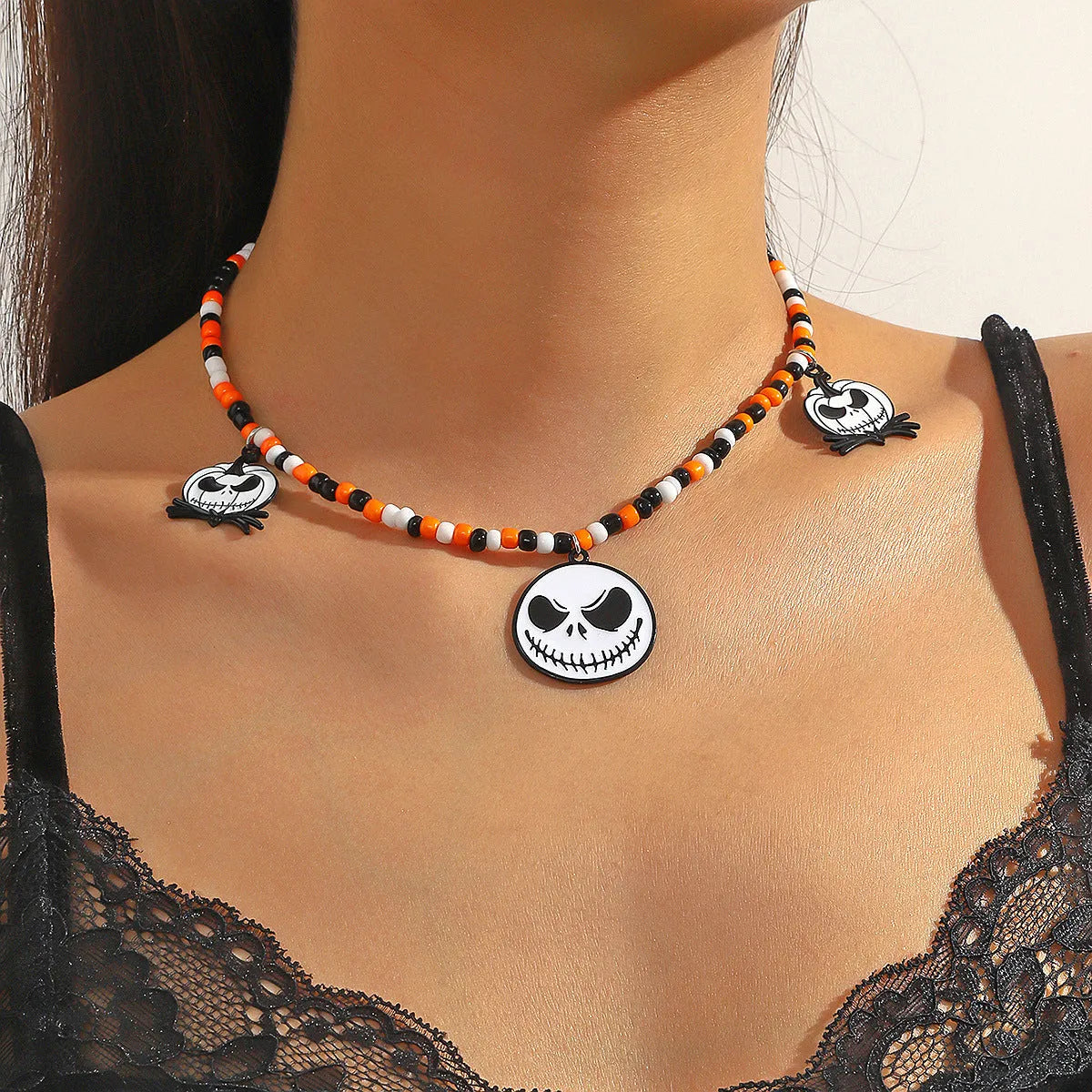 Halloween necklace with bat, ghost and skull pendants on bamboo chain