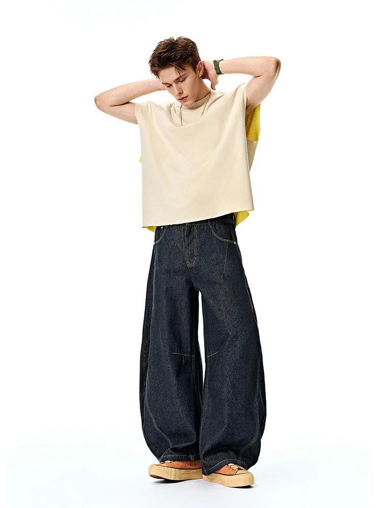 Men's wide leg denim trousers in original cow colour showing mid-waist design and cotton fabric