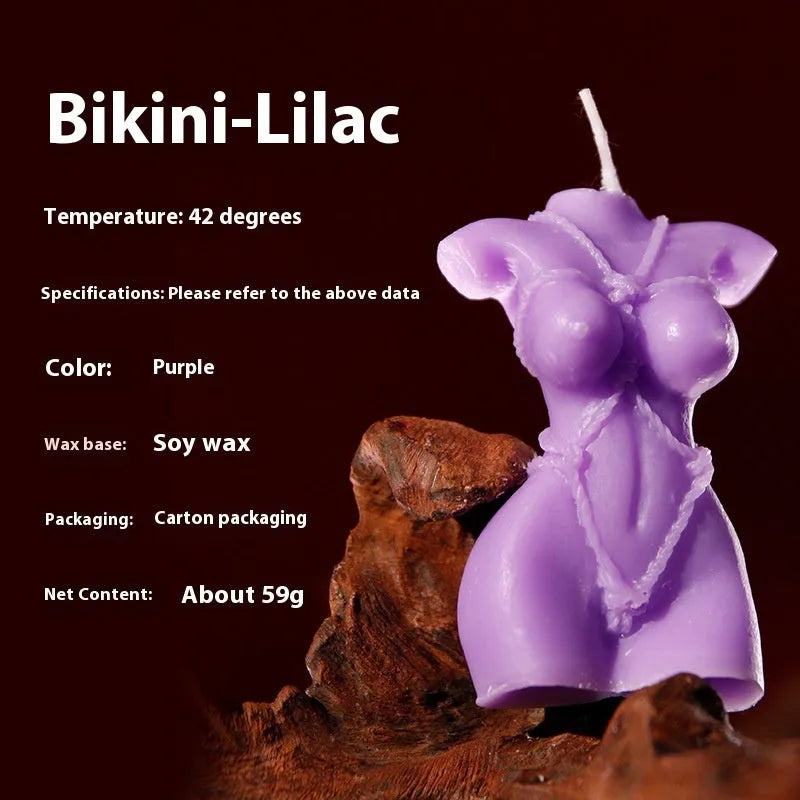 Smsexy Props soy wax bikini-shaped fragrance candle in red, pink, or purple.