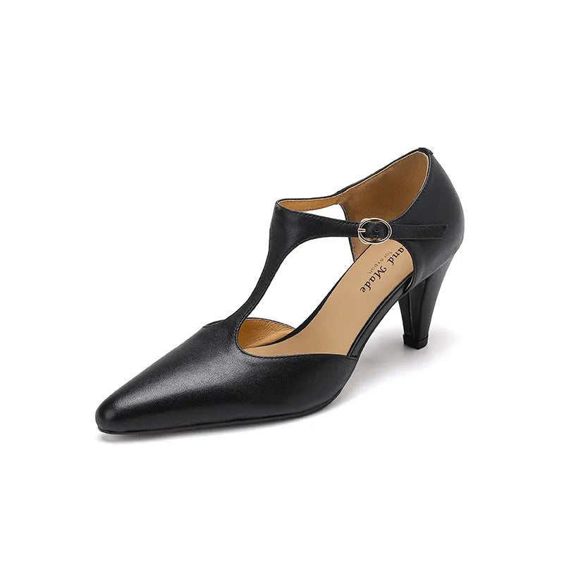 Brown retro women's T-strap sandals with a closed round toe, buckle fastening, and a chunky block heel.
