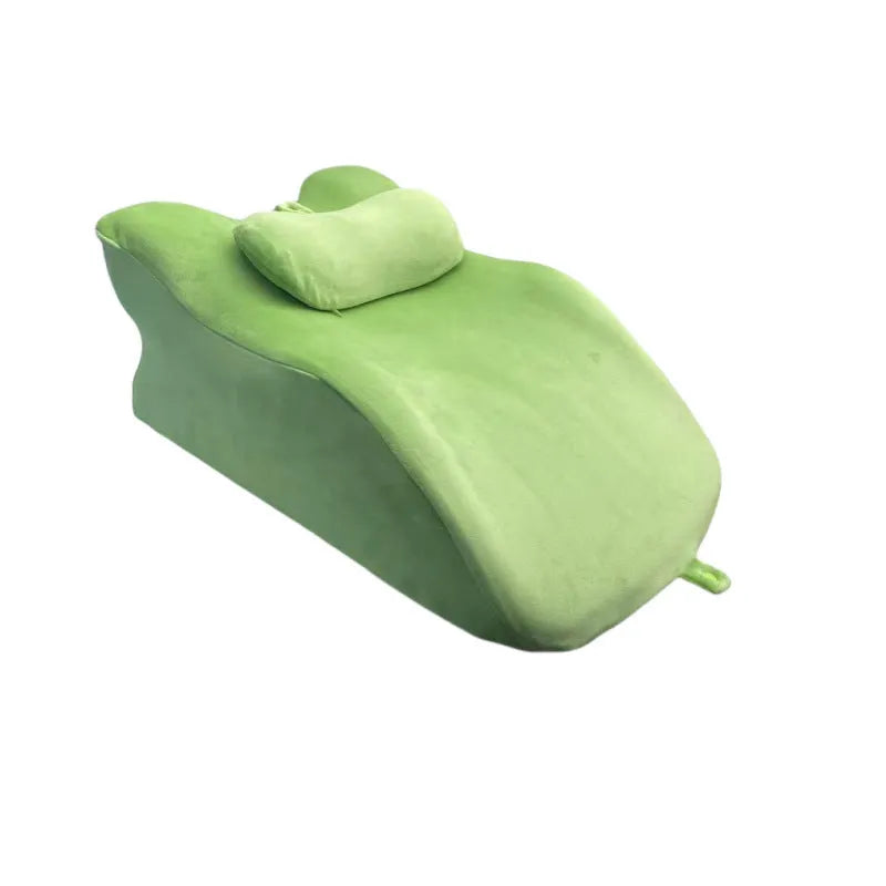 Ergonomic stomach sleeper pillow for reading in bed, shown in blue colour