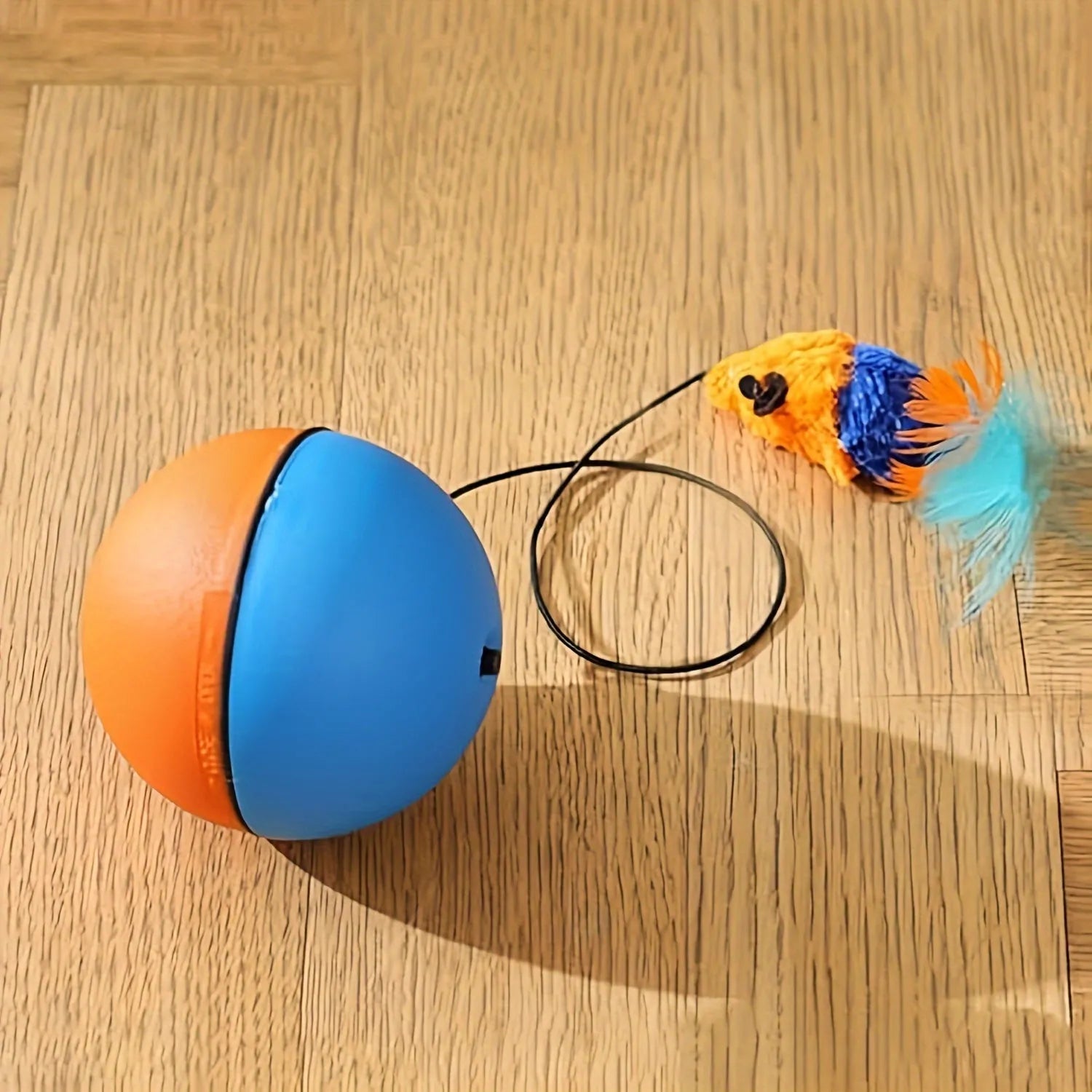 Interactive blue and orange cat toy ball with removable plush mouse for feline play
