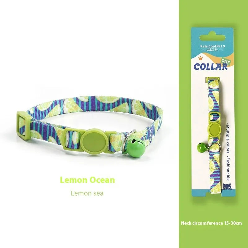 Woven polyester cat collar with anti-suffocation safety buckle and bell in green jungle colour grid pattern