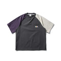 Dark grey men's loose-fit T-shirt with contrast colour raglan sleeves on a hanger.