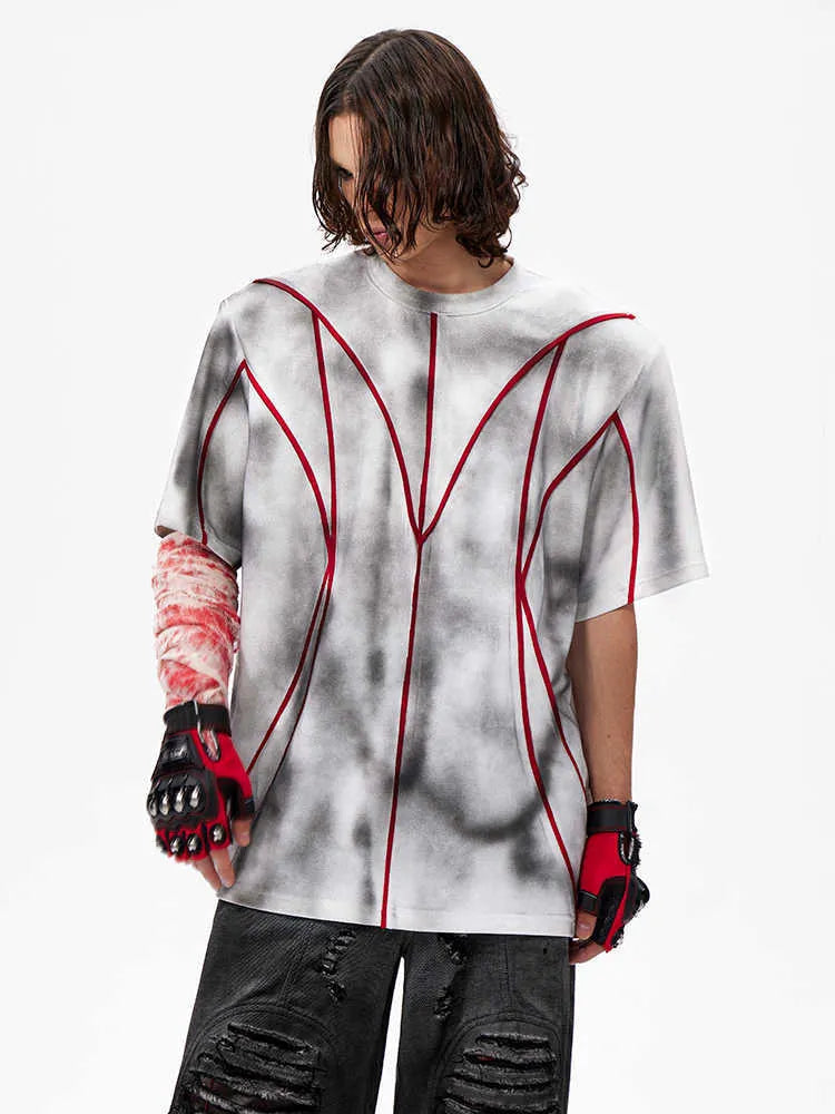 Women's short sleeve t-shirt with padded shoulders and raised line patchwork design on a round neck.