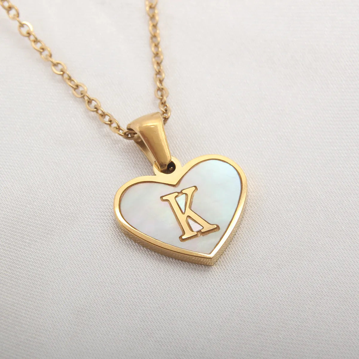 Gold plated personalised heart necklace with white shell on a 45cm chain