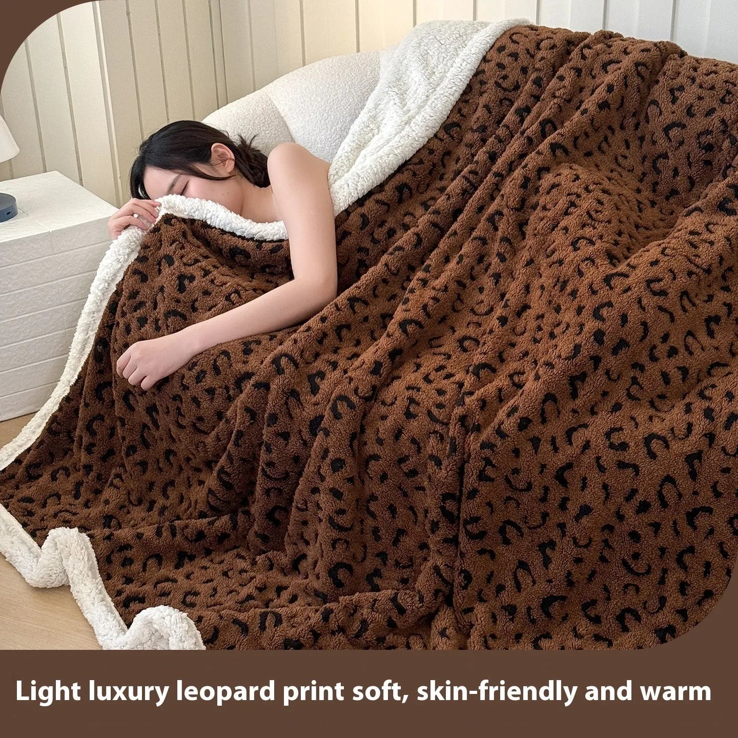Double-layer leopard jacquard taffeta blanket in camel zebra pattern on a single bed.