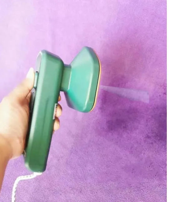 Dark green portable hanging ironing machine with ceramic panel and sharp corner design for travel use