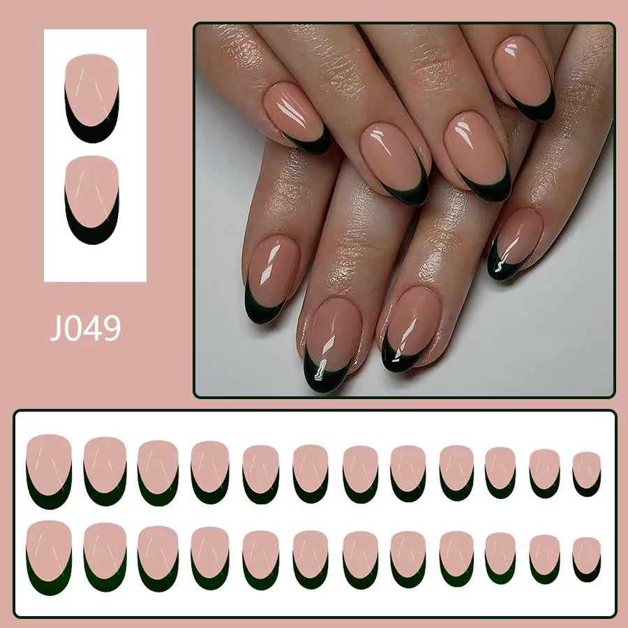 Set of 24 short almond-shaped false nails in a simple black French style design on a white background.