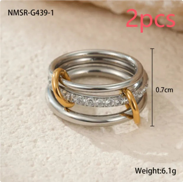 Stacked colour matching stainless steel ring set with 18K gold plating and exaggerated profile