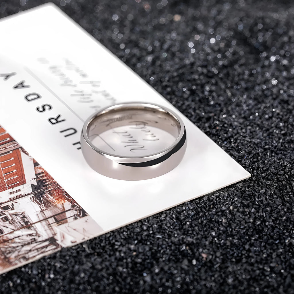 Matte silver titanium ring showing different band width options on a plain background