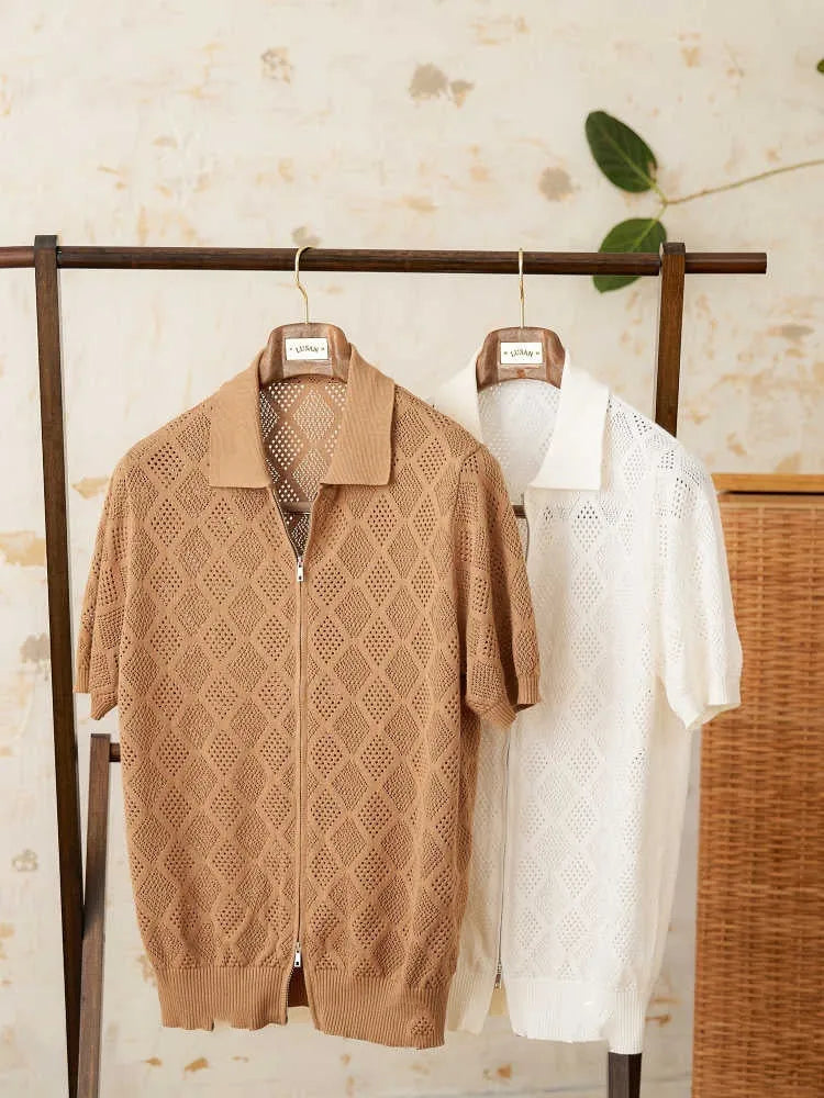 Light brown cotton short sleeve cardigan with lapel collar and front zipper closure on hanger
