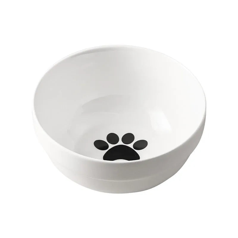 Ceramic cat bowl with iron frame stand showing cat paw print pattern and gold metal finish