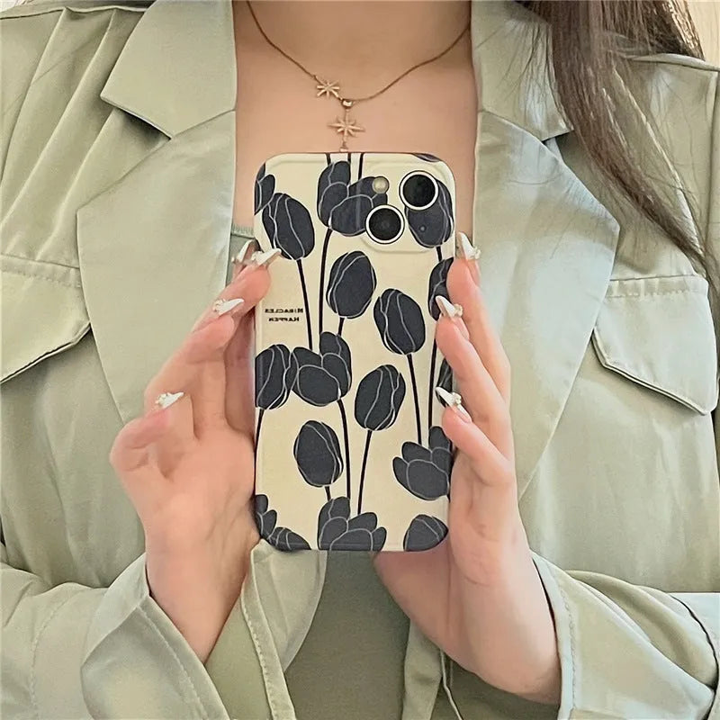 Black tulip patterned silicone iPhone case shown on an iPhone
