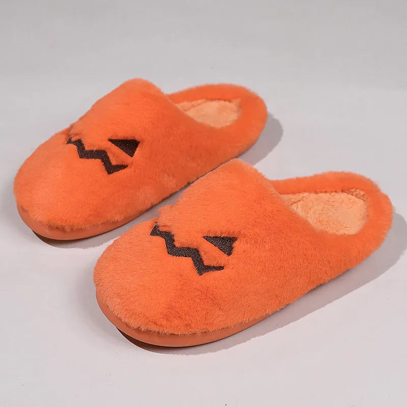 Orange pumpkin design Halloween slippers with plush lining and PVC sole for indoor home wear