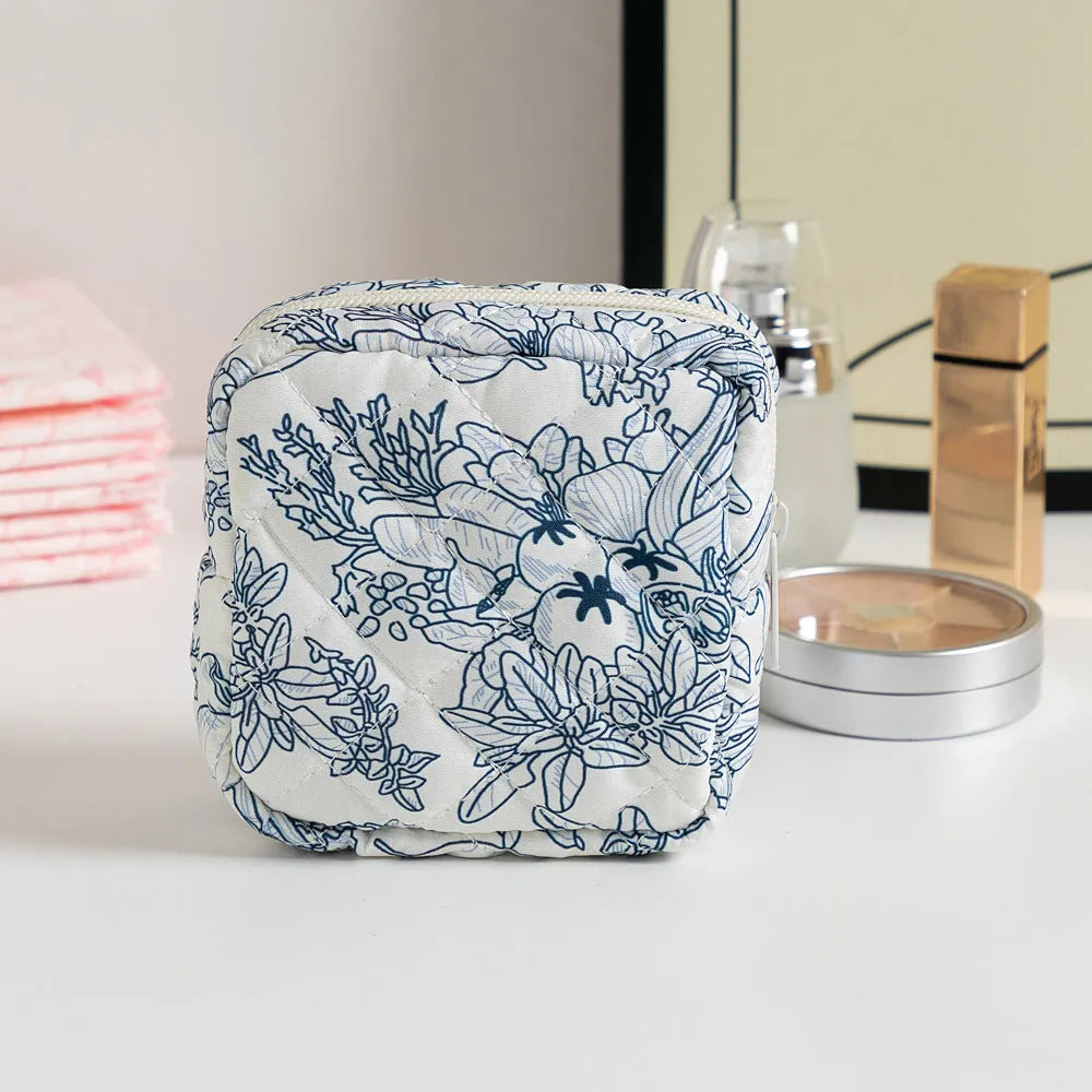 Floral polyester key storage bag with sewing thread detailing in multiple colour patterns