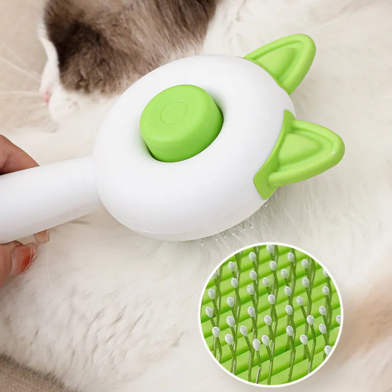 Greenish white cat grooming brush with stainless steel self-cleaning teeth and TPR massage tips