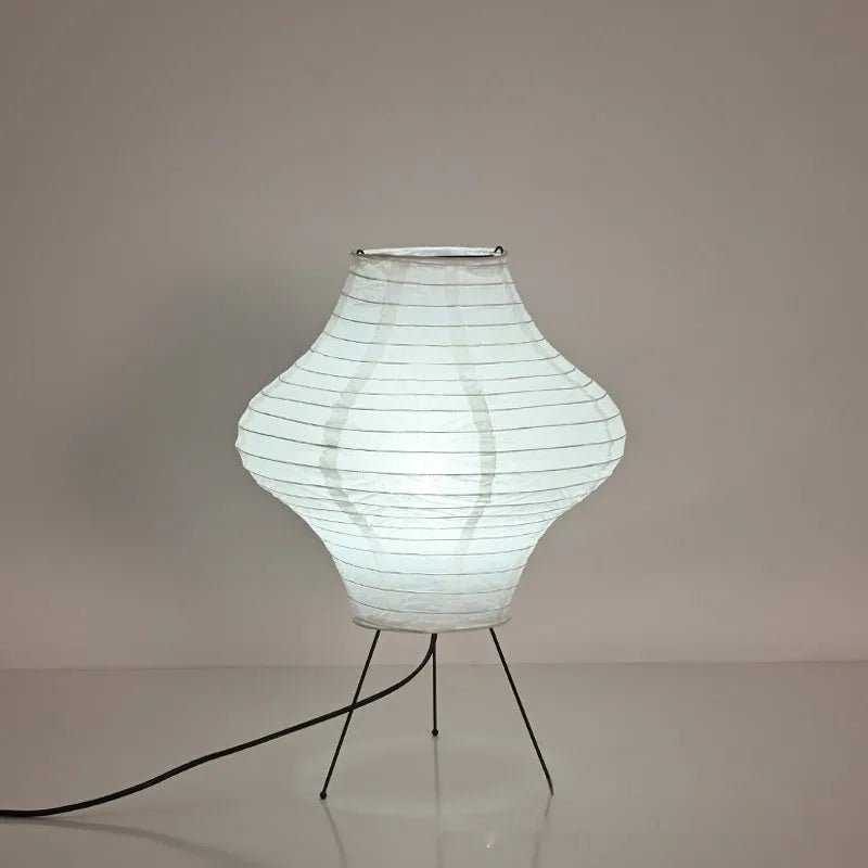 Japanese-style Xuan paper table lamp with a white shade on a wooden base.