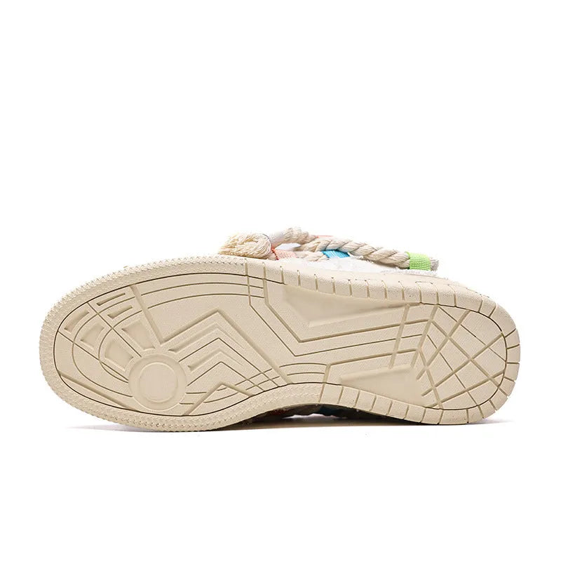 Old Damage creamy white retro low-top skate shoes with lace-up front and platform sole.
