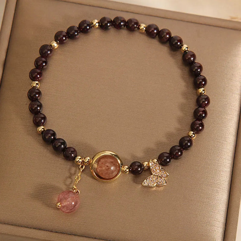 Black stone micro inlay butterfly pendant bracelet on wrist