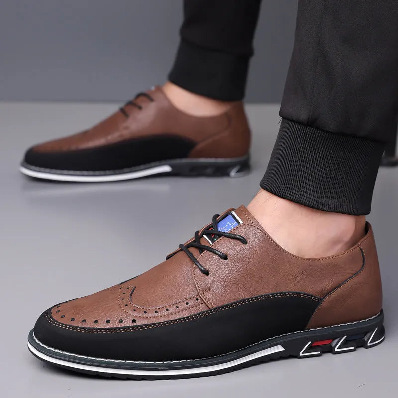 Men's black casual leather slip-on shoes with a rubber sole and visible sewing line details on a leather toe cap.