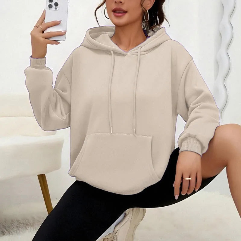 Women's loose fit grey drawstring hood sweatshirt with front pockets, long sleeves