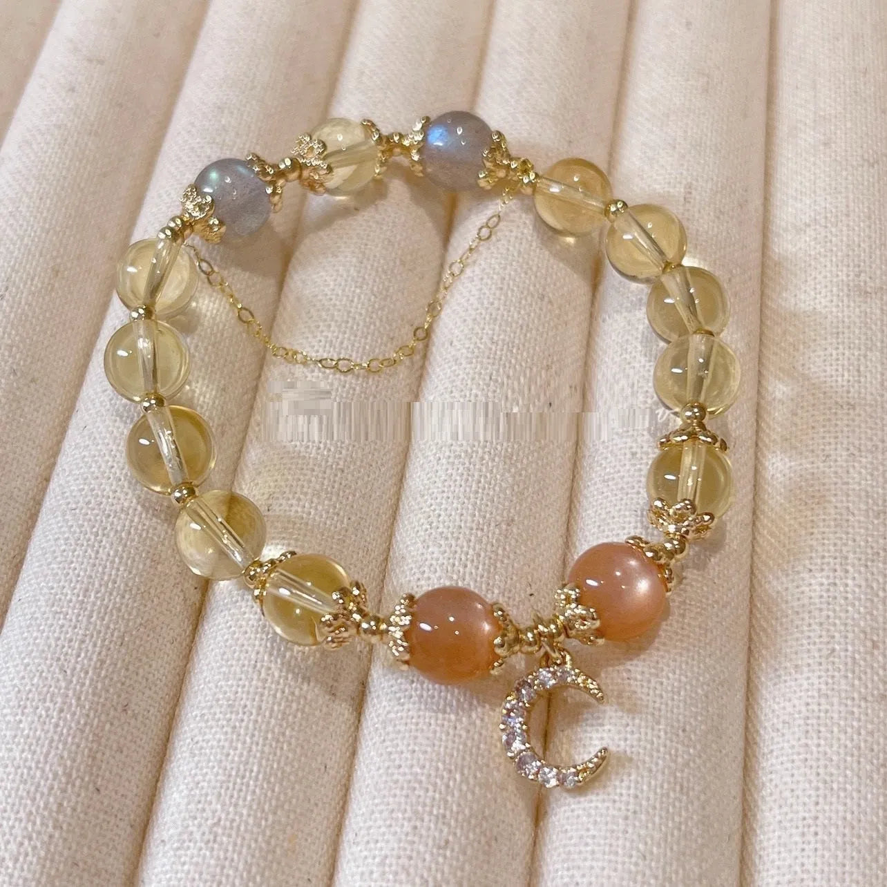 Chinese style crystal bracelet with 14K electroplated gilding and diamond-shaped citrine moon coloured elements