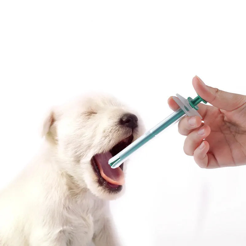 Two silicone pet pill shooter syringes, one 15cm and one 11.5cm, for feeding medication to cats and dogs.